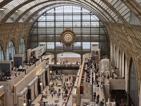The clock above the galleries at the end of the hall